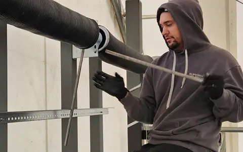Garage door technician repairing a garage door